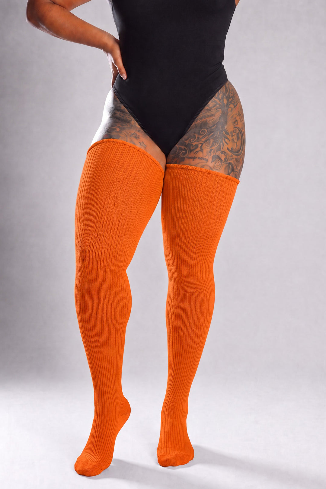Plus size thigh high socks in warm pumpkin orange