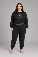 Two-piece sleepwear set in soft neutral fabric, includes top and shorts