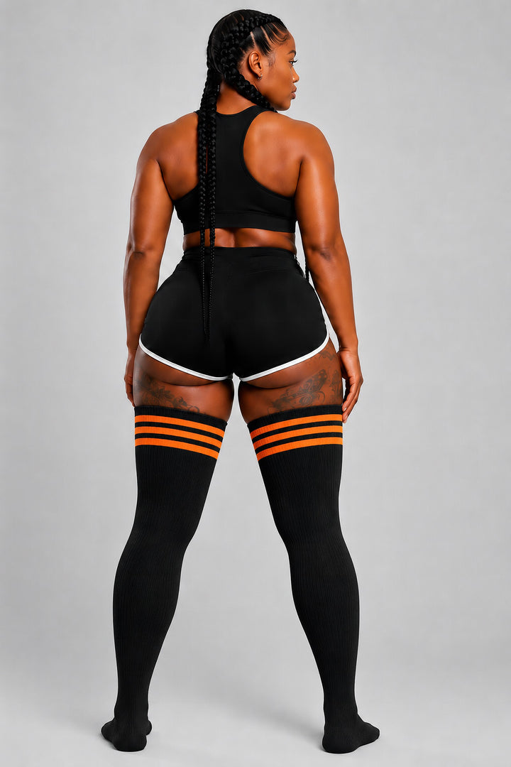 Plus size thigh high socks in black and orange pumpkin stripes