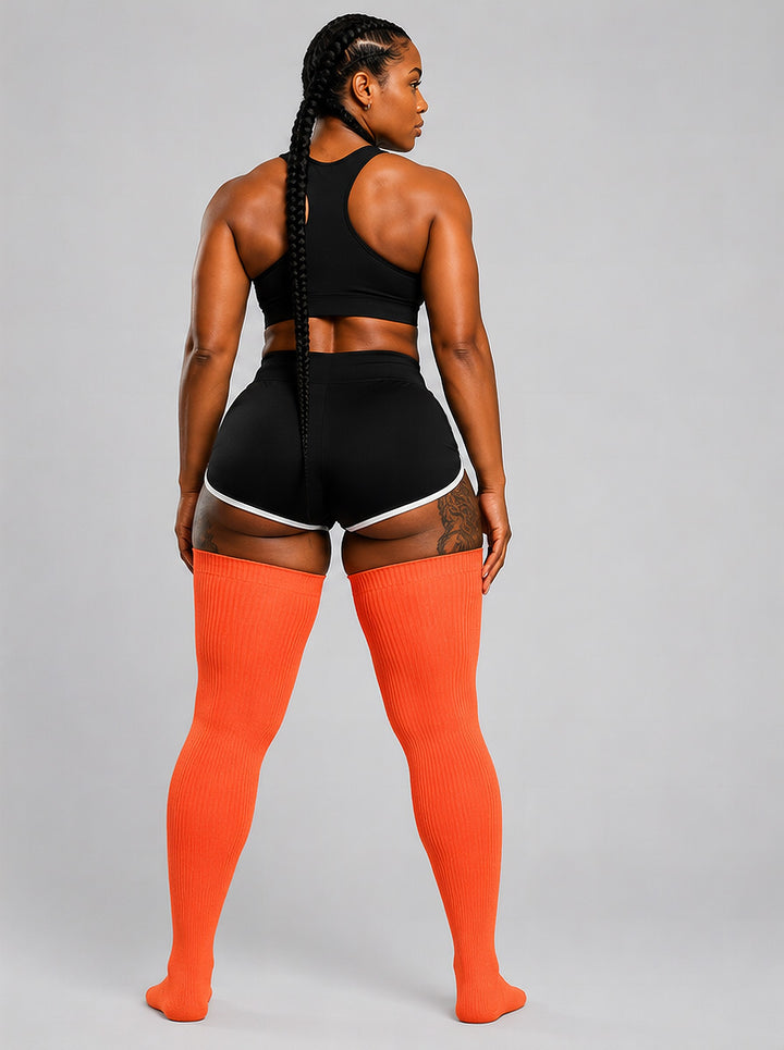 Plus size thigh high socks in warm sunset orange and pink tones