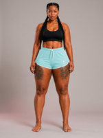 Aqua Performance Flex Shorts on model