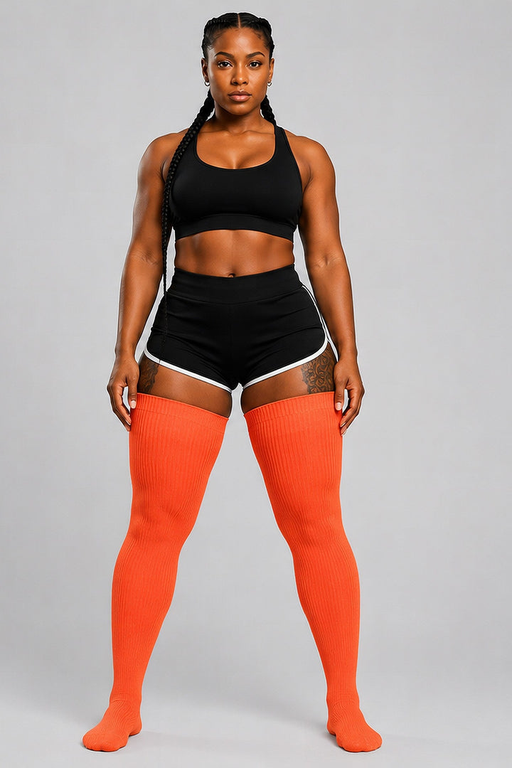 Plus size thigh high socks in warm sunset orange and pink tones