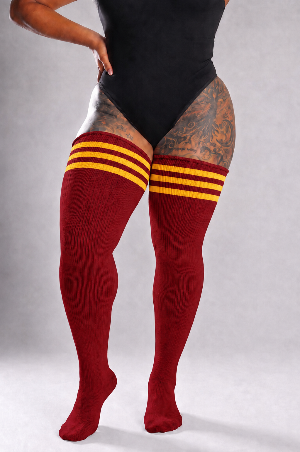 Thigh high plus size socks with bold lion-themed stripe pattern, over-the-knee length