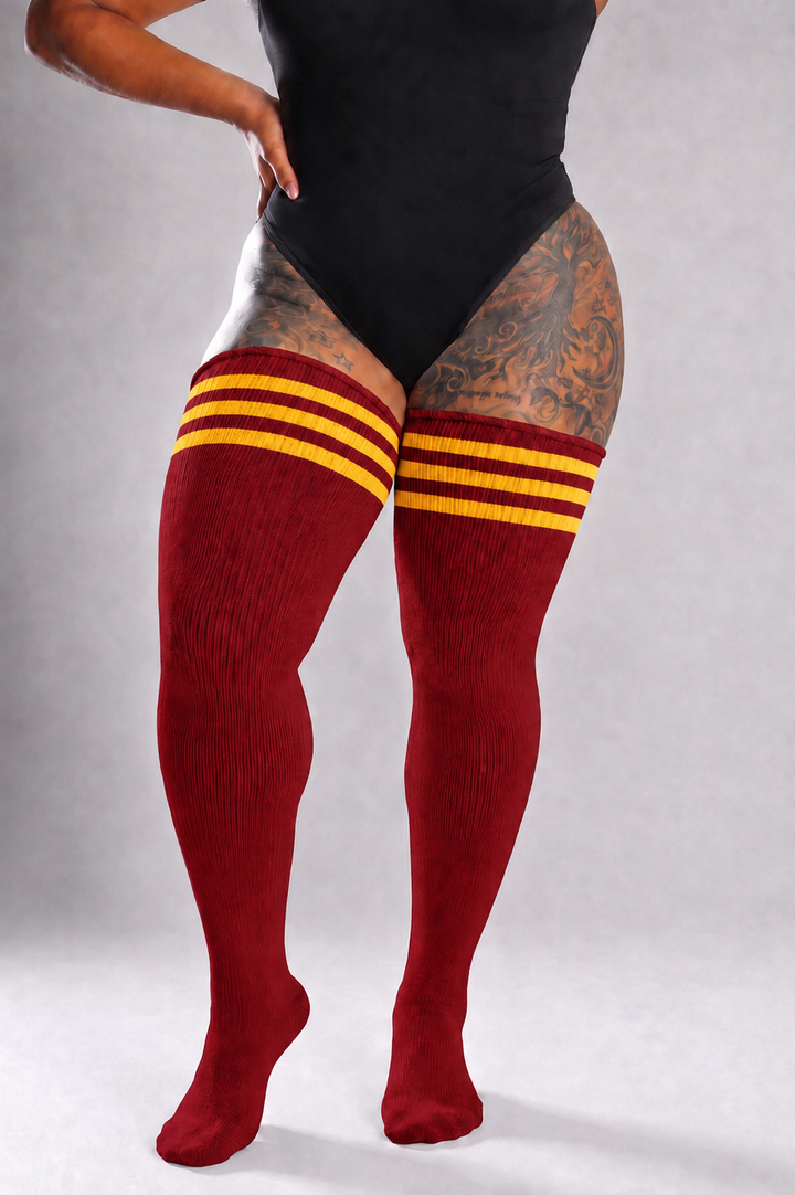 Thigh high plus size socks with bold lion-themed stripe pattern, over-the-knee length