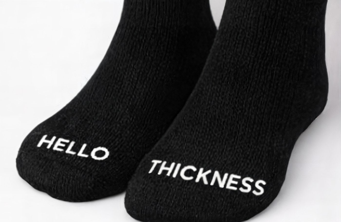 HELLO and THICKNESS printed on the toes of the socks